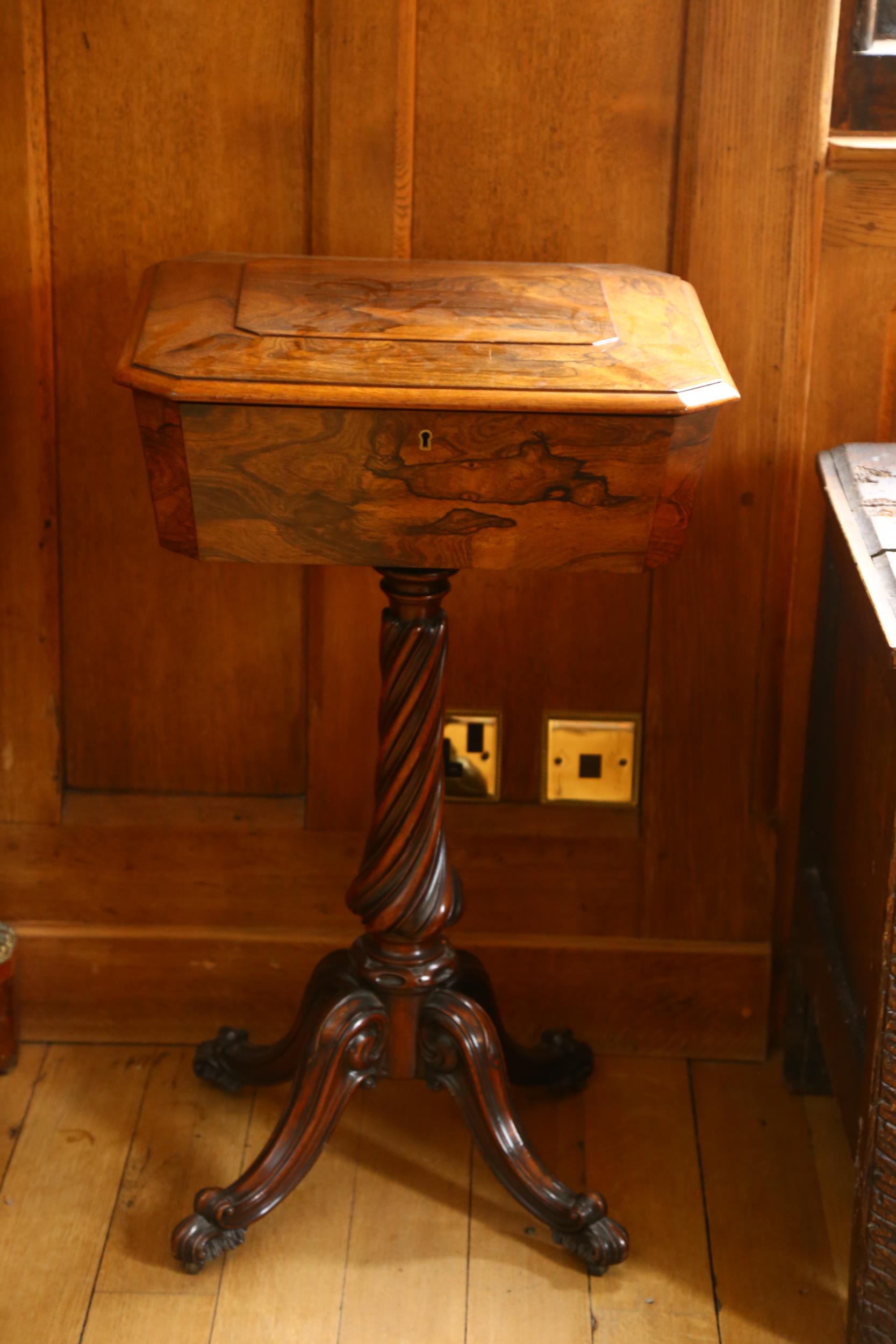 A Regency rosewood teapoy, square canted form with hinged cover opening to reveal fitted interior