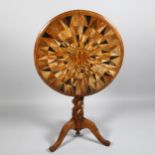 A 19th century specimen wood parquetry-topped circular tilt-top table, with barley twist centre
