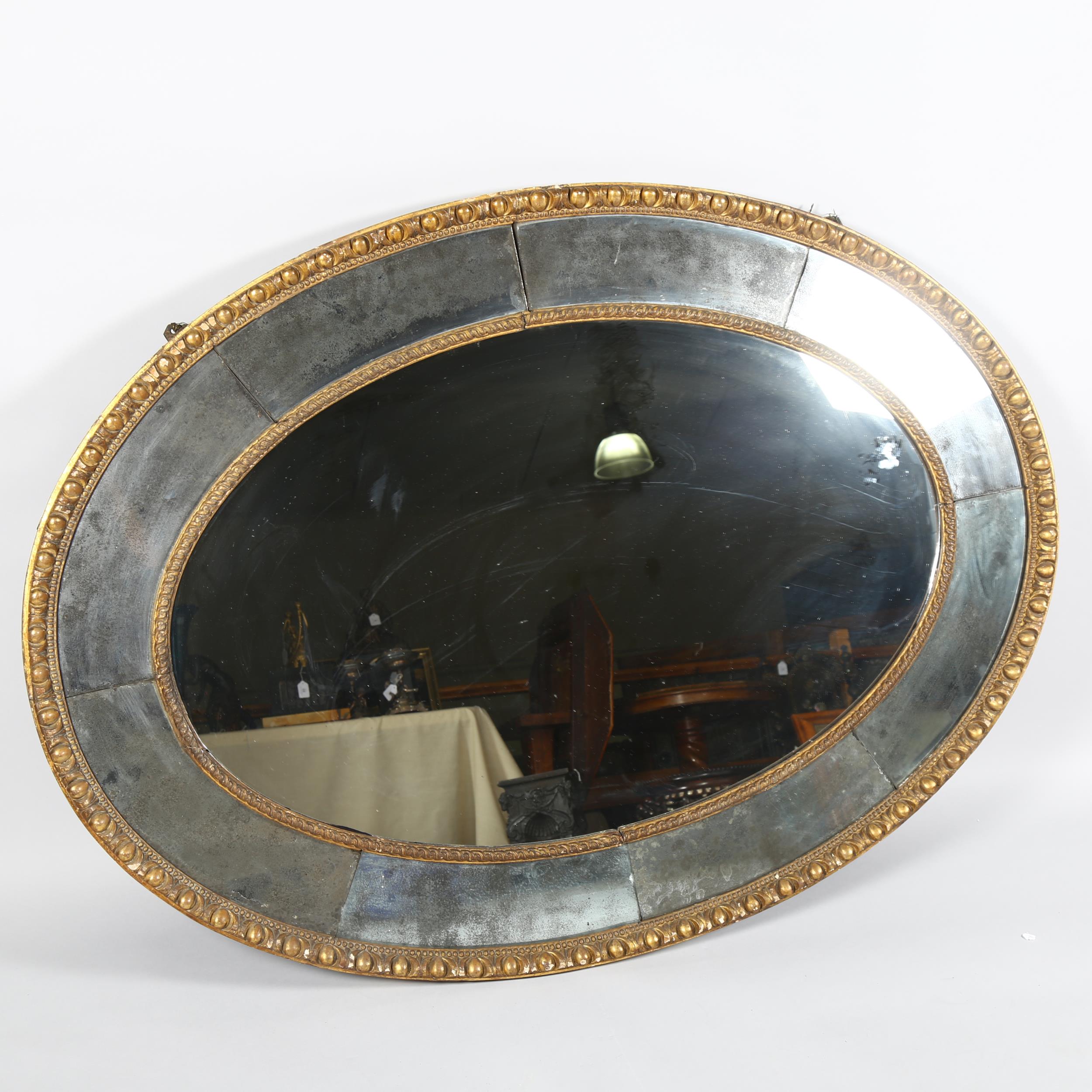 A large oval gilt-framed wall mirror, with inset oxidised mirrored surround, overall measurements - Image 2 of 8