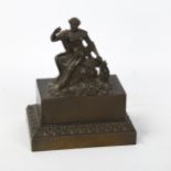 A 19th century patinated bronze figural desk companion, with Classical lady cover opening to