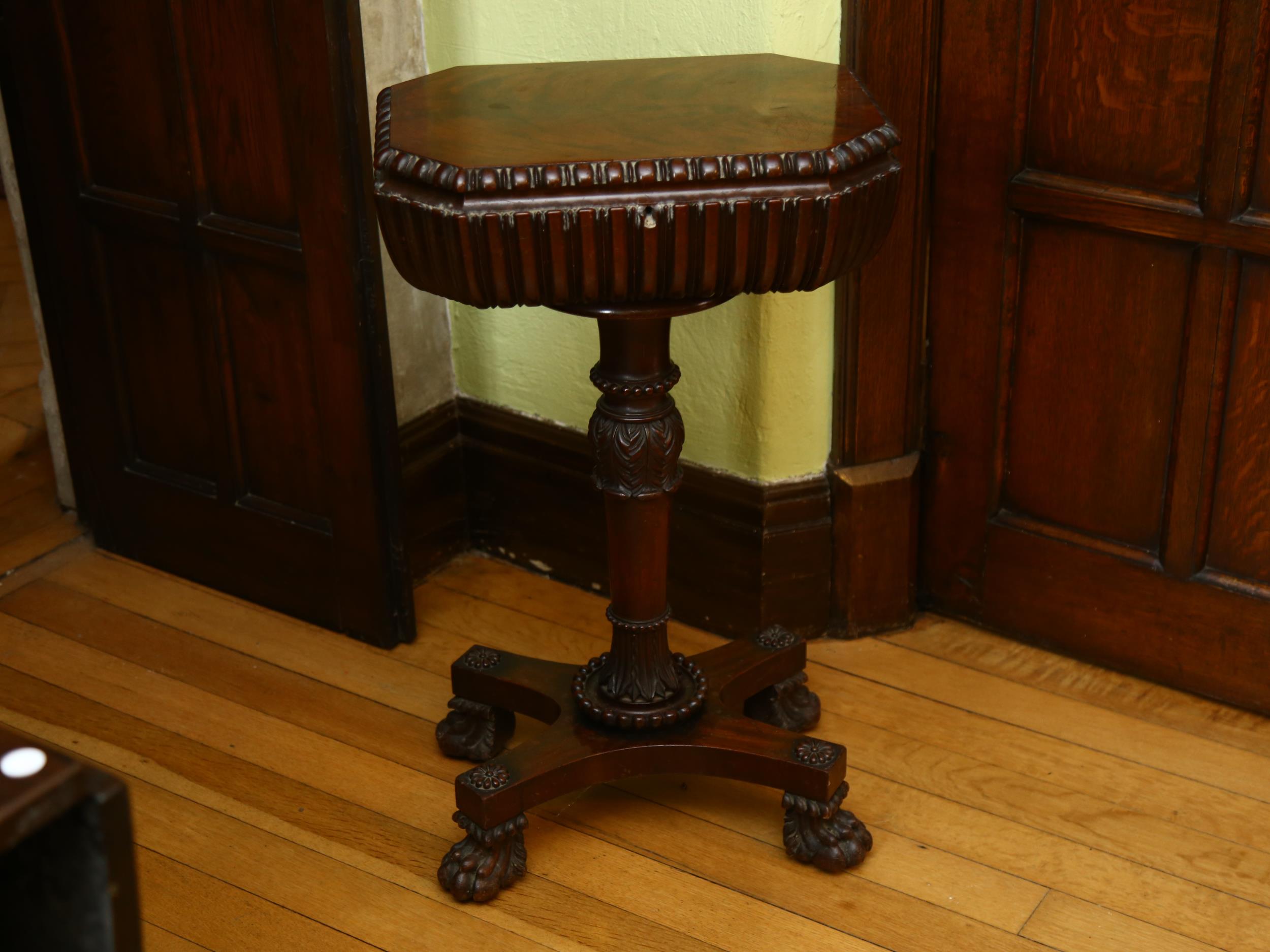 A William IV mahogany teapoy, on carved tulip centre column and lion paw feet, 47cm x 35cm, height