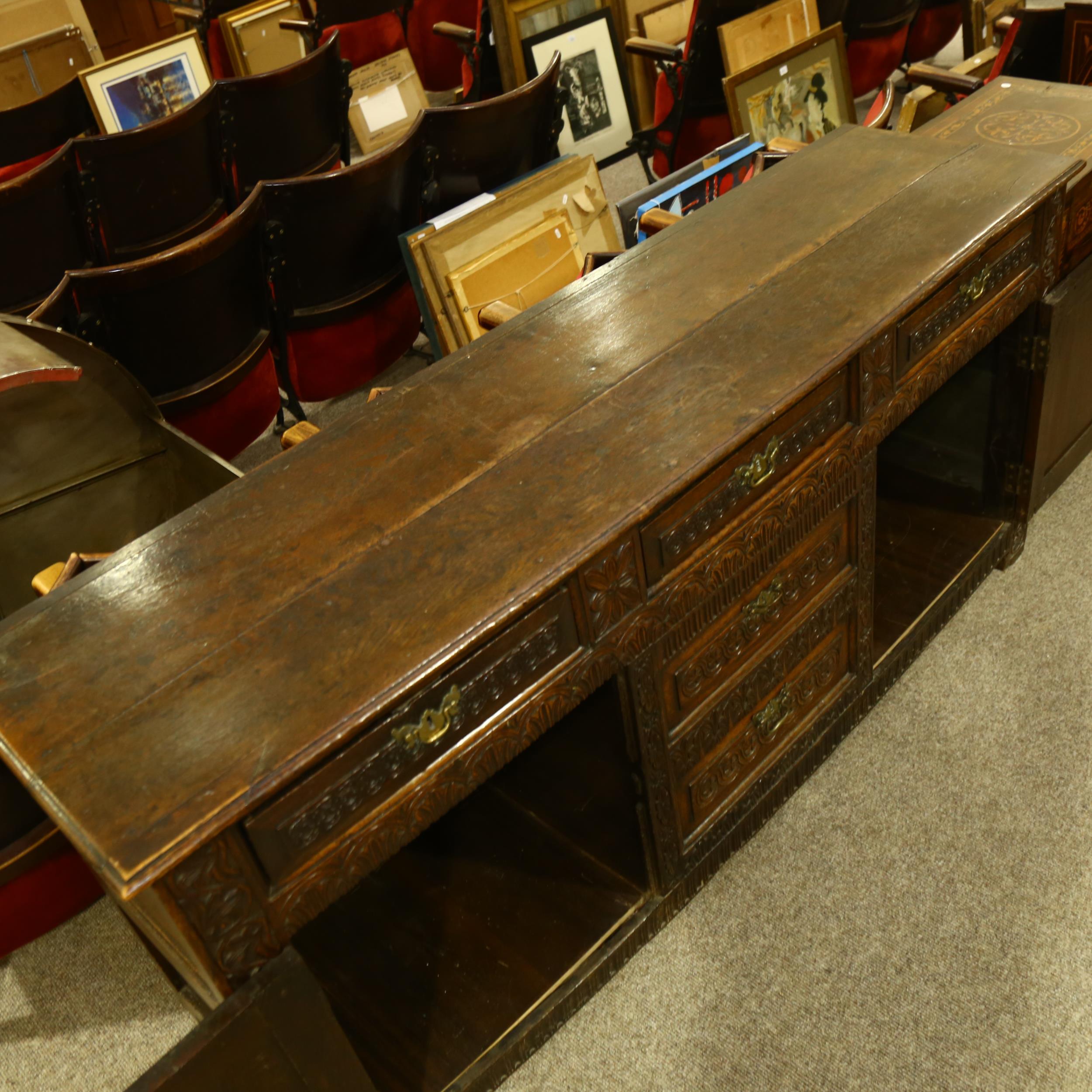 An 18th century oak dresser base, 3 carved frieze drawers with central dummy drawers below flanked - Image 6 of 6