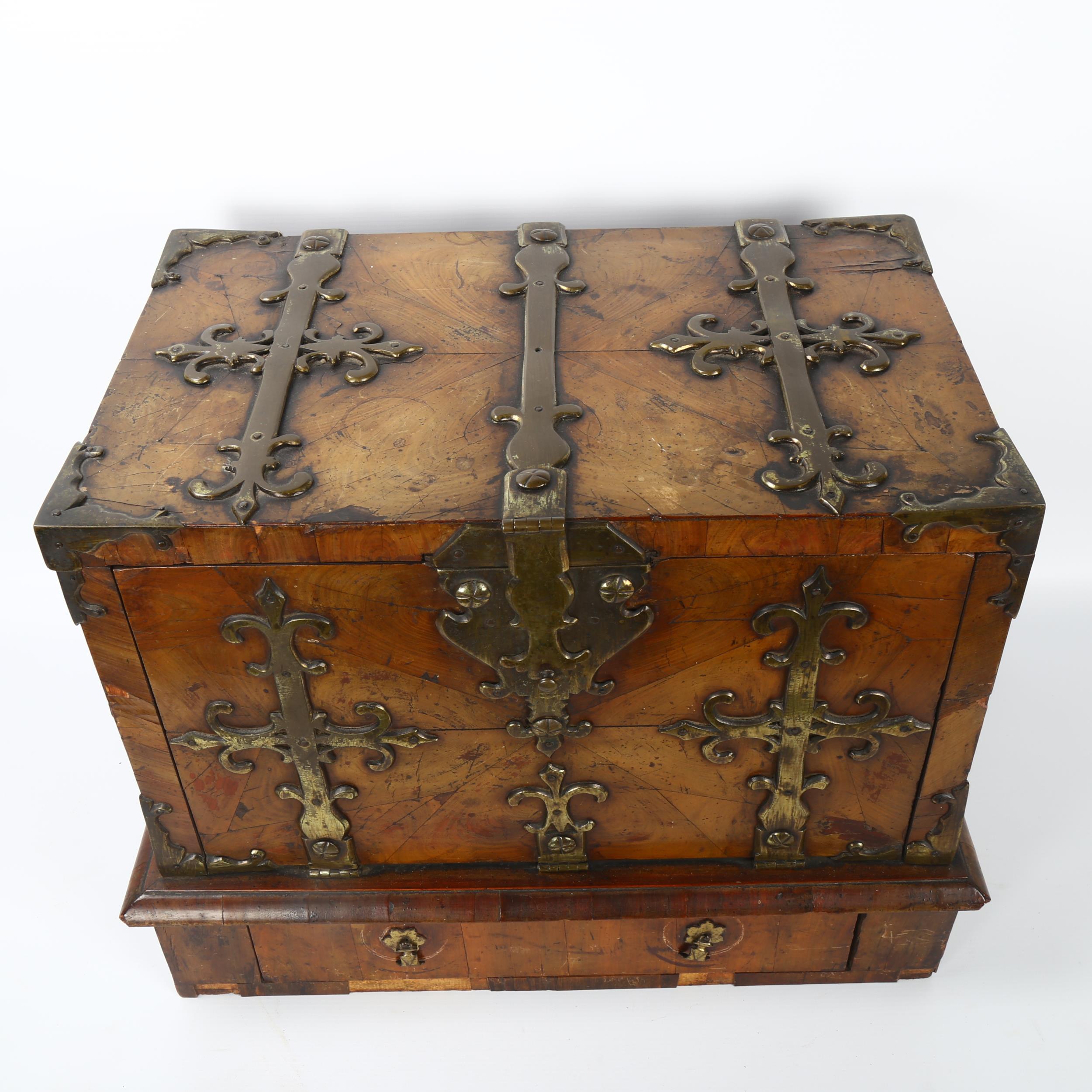 A small 18th century Gothic brass-bound walnut travelling chest, allover heavy brass strapwork - Image 5 of 6