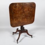 A Regency square mahogany tilt-top table, on carved quadruple base with brass casters, 74cm x 63cm