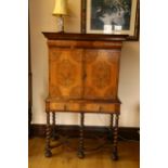 A William and Mary walnut olivewood and kingwood cabinet on stand, circa 1690, the moulded cornice