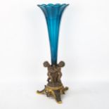 A 19th century parcel-gilt silver plate cherub table centre epergne, with cobalt blue glass liner,