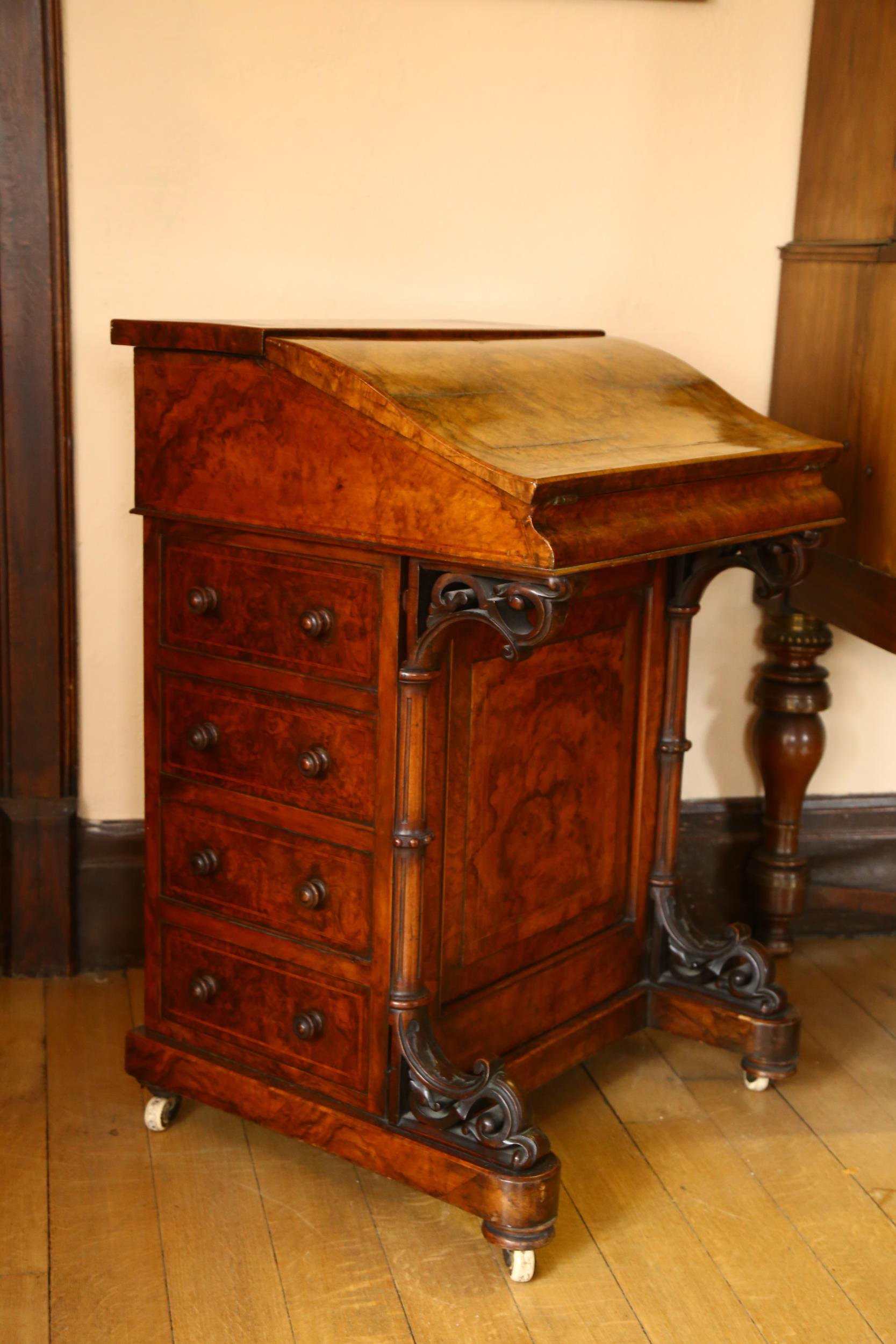 A Victorian burr-walnut Davenport, with slope front, hinged stationery rack backing, 4 side