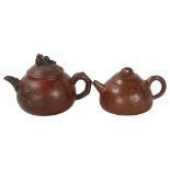 A Chinese Yixing style teapot with monkey knop, character marks to base and sides, height 12cm