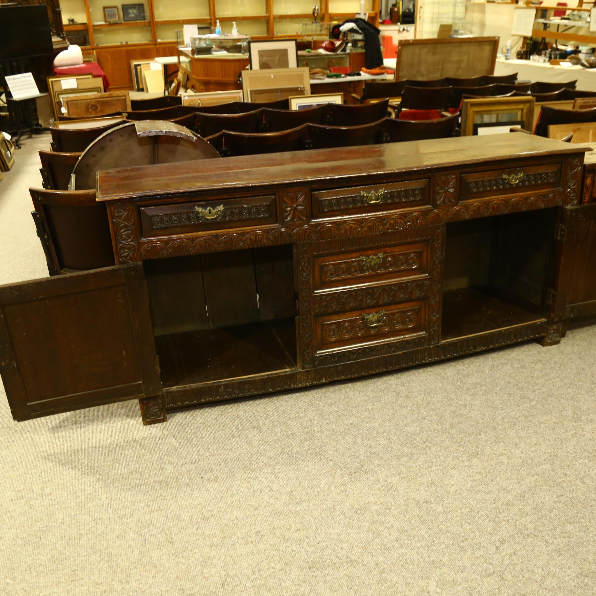 An 18th century oak dresser base, 3 carved frieze drawers with central dummy drawers below flanked - Image 5 of 6