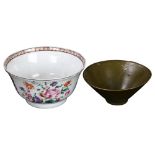 An Antique Chinese export enamelled tea bowl, together with a green glazed tea bowl, largest