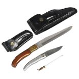 **WITHDRAWN** A Laguiole folding knife, and a smaller pocket knife, leather scabbards (2)