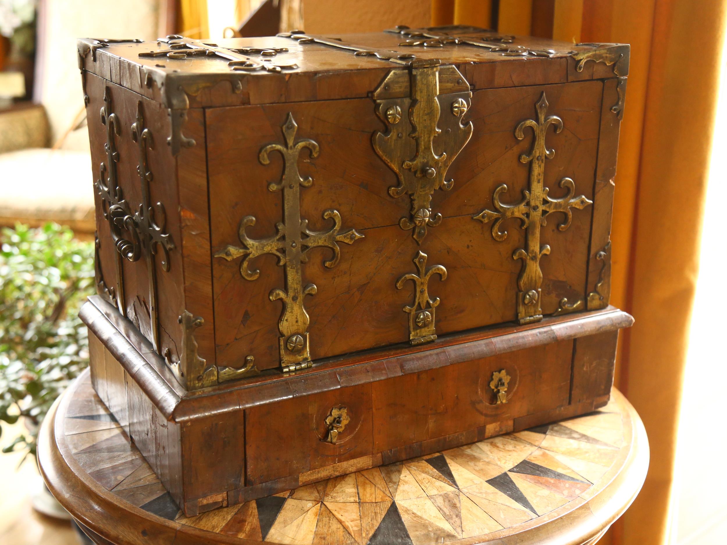 A small 18th century Gothic brass-bound walnut travelling chest, allover heavy brass strapwork