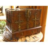 A small 18th century Gothic brass-bound walnut travelling chest, allover heavy brass strapwork