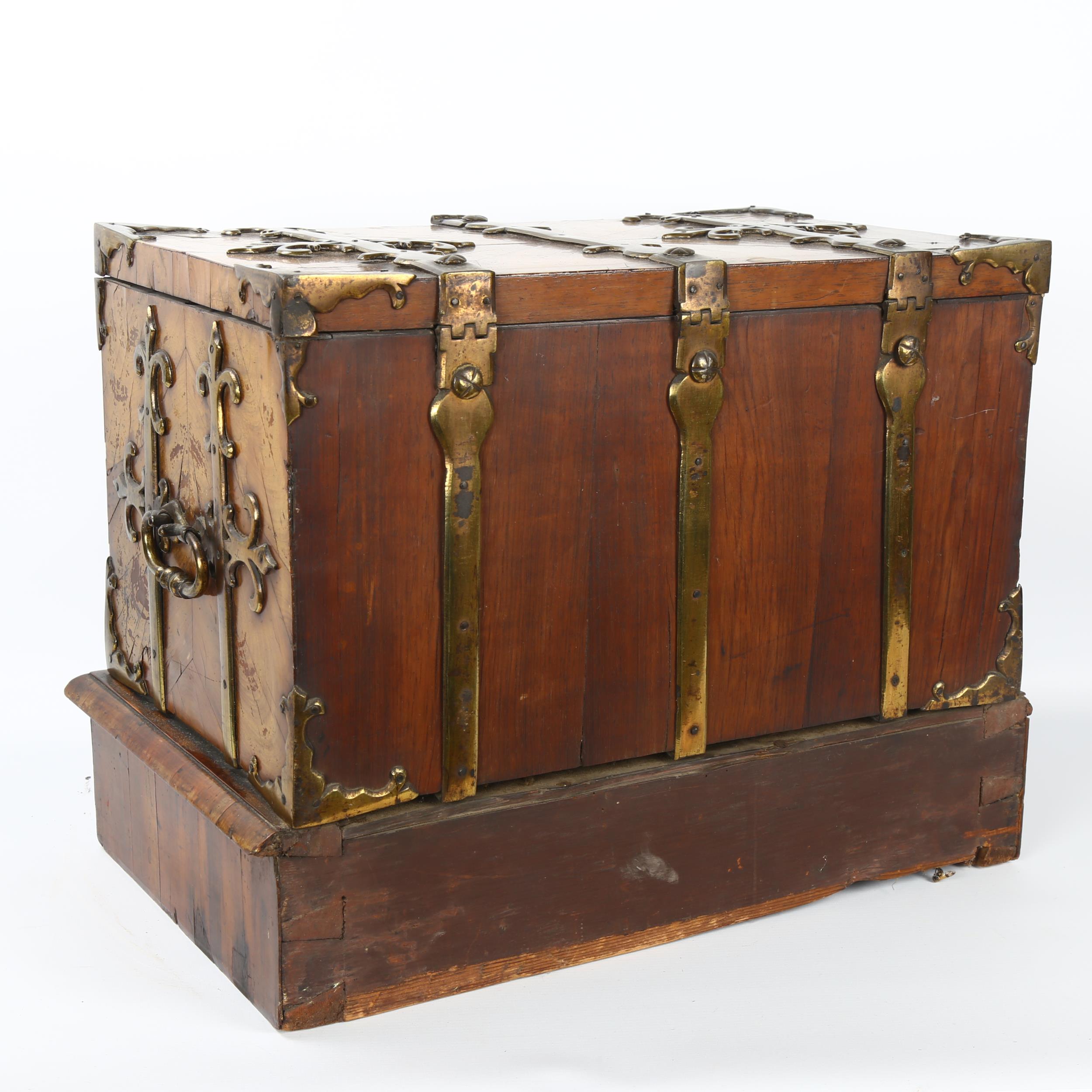 A small 18th century Gothic brass-bound walnut travelling chest, allover heavy brass strapwork - Image 6 of 6