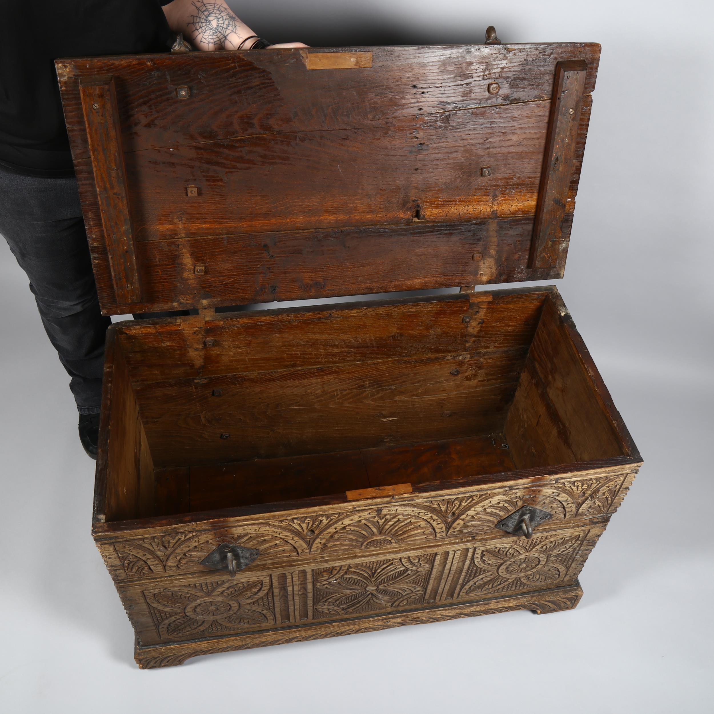 18th century Continental oak chest, heavy iron strapwork hinges and hasps to the lid, allover chip - Image 4 of 6