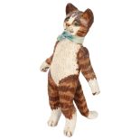 A late 20th century ceramic standing cat, with articulated front legs, unsigned, height 14cm Good