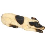 Gerard Rigot (b.1929), France, a wood carved and painted crouching dog, signed to base, length, 51cm