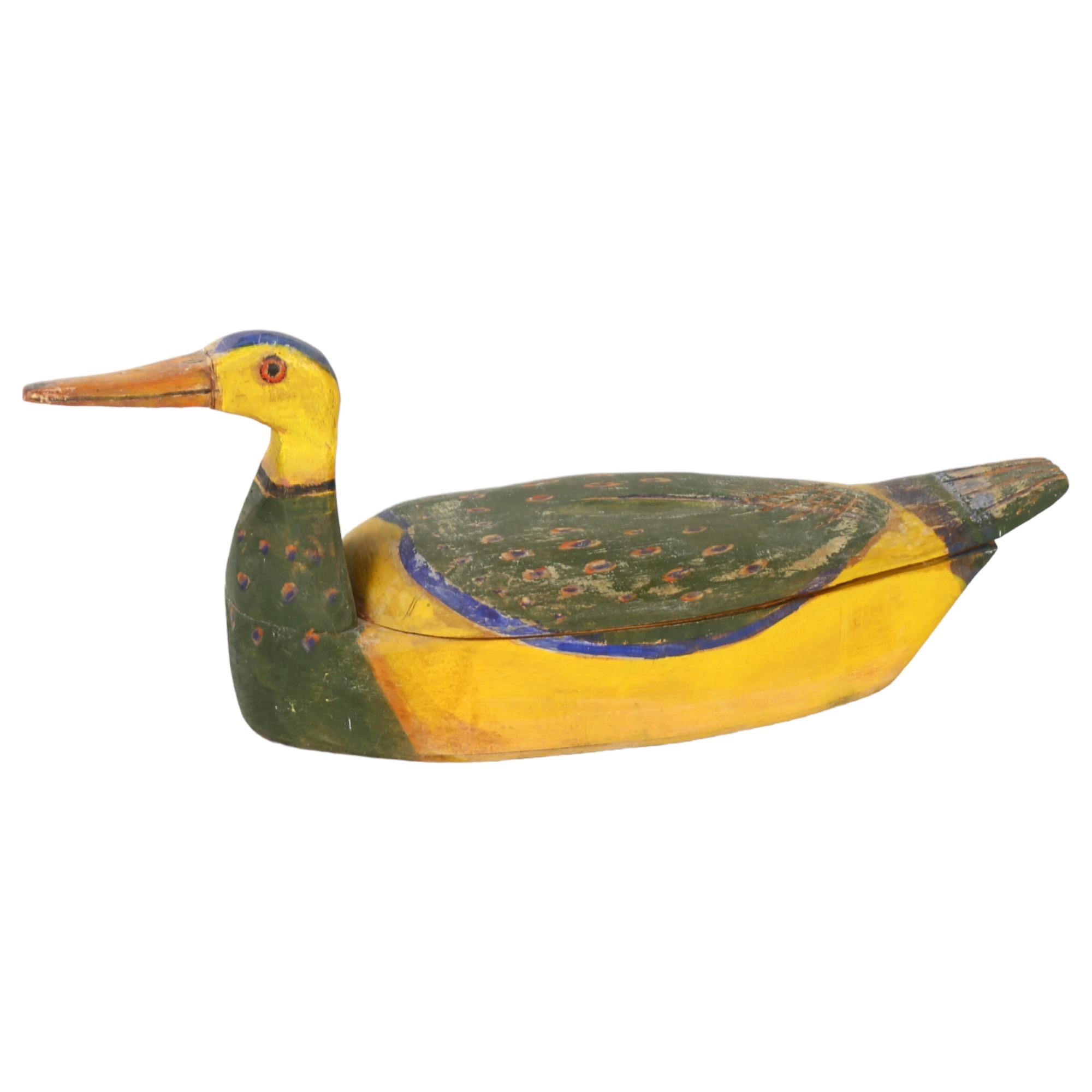 Gerard Rigot (b1929), a wooden hand carved and painted box in duck form, signed to base, length 38cm