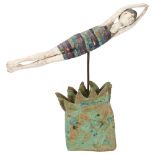 Jane Muir, studio ceramic sculpture of a swimmer in waves, pen signed to base, height 29cm, length