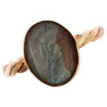 An Antique 9ct rose gold butterfly wing ring, with oval convex glass cover and closed-back settings,