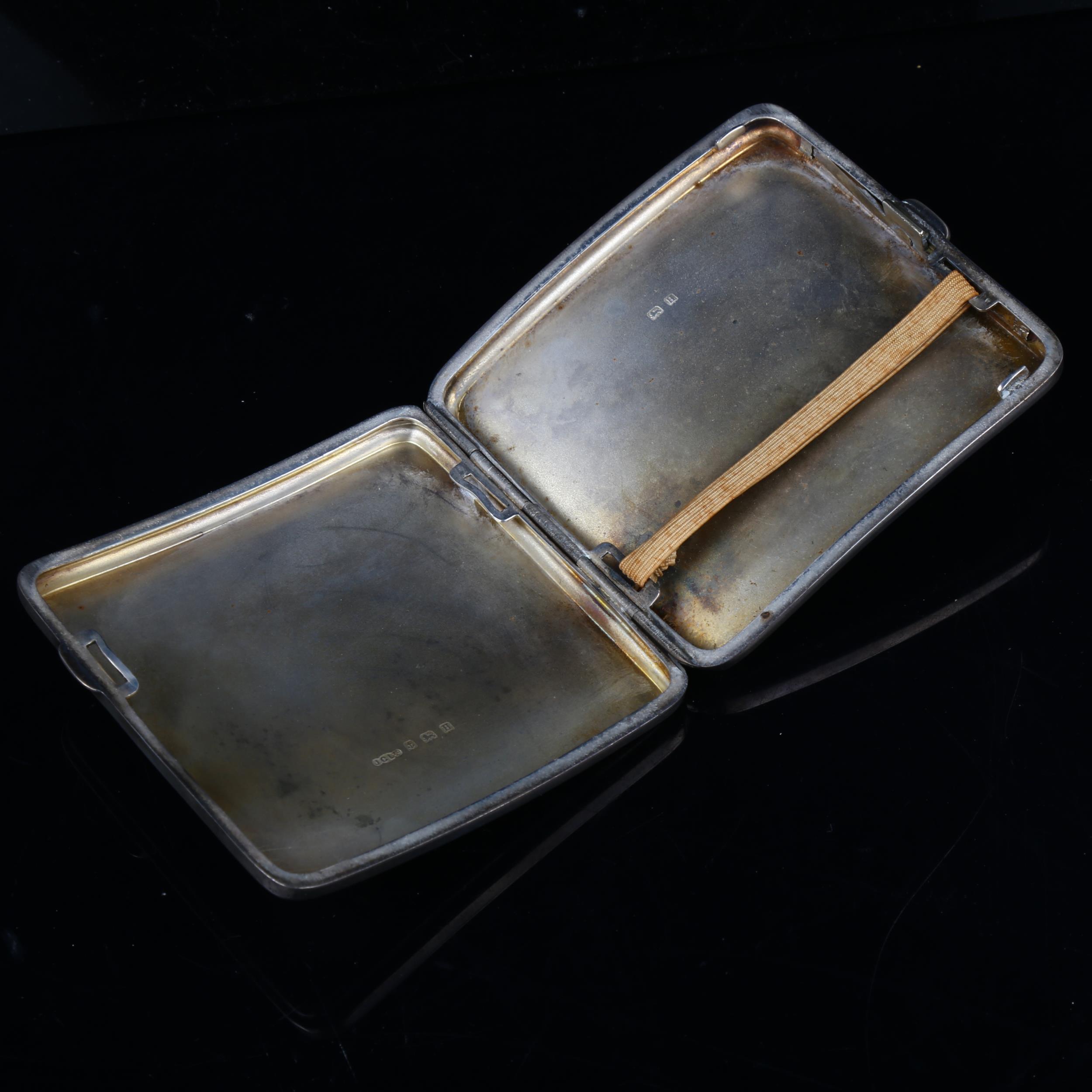 An Art Deco George V curved silver cigarette case, allover engine turned decoration with gilt - Image 2 of 3