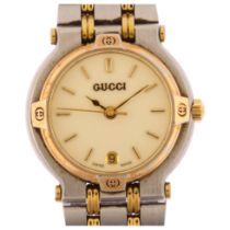 GUCCI - a lady's gold plated stainless steel 9000L quartz bracelet watch, cream dial with gilt baton