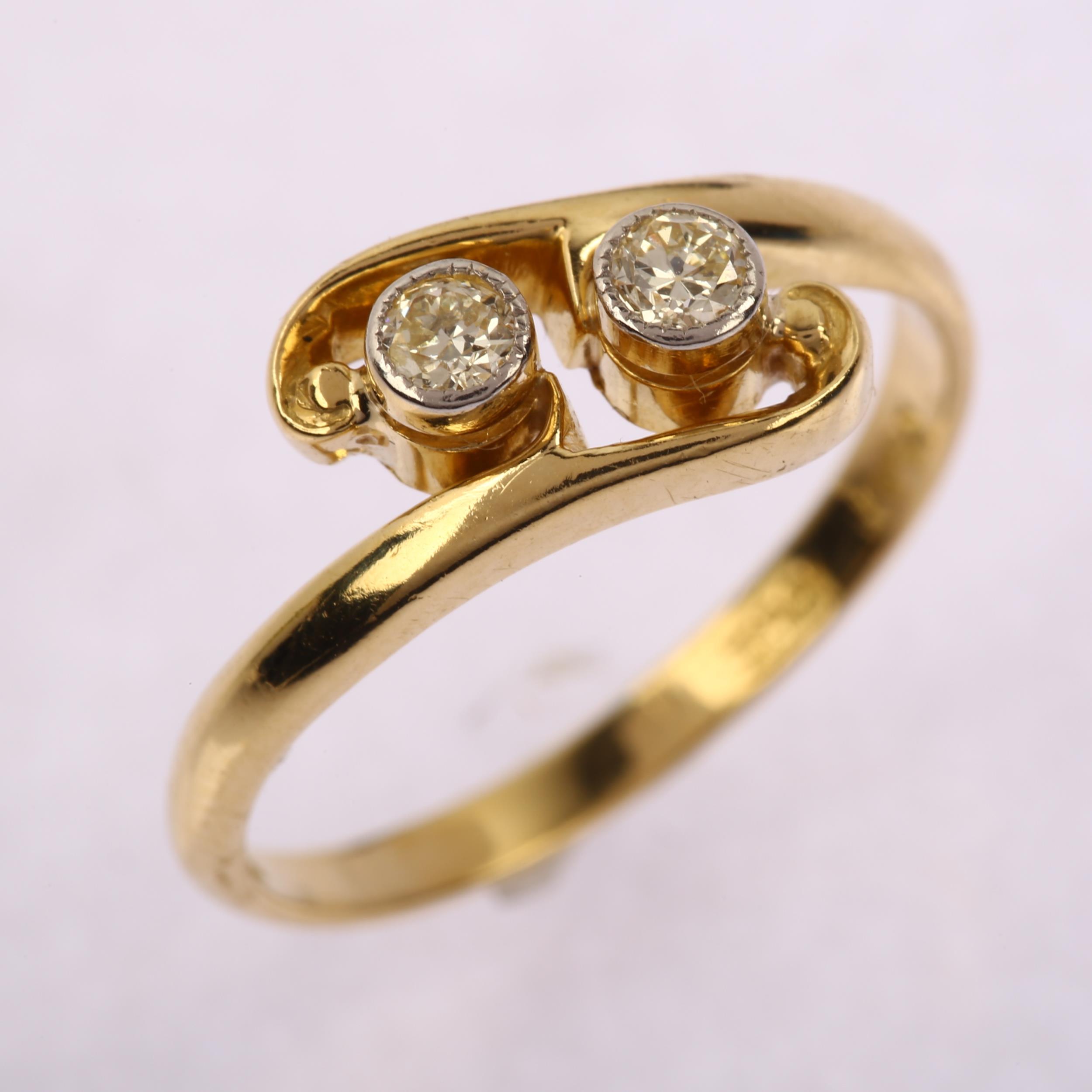 An early 20th century 18ct gold two stone diamond crossover ring, platinum-topped set with modern - Image 2 of 4