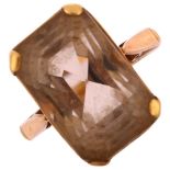 A late 20th century smoky quartz dress ring, unmarked gold settings with rectangular step-cut