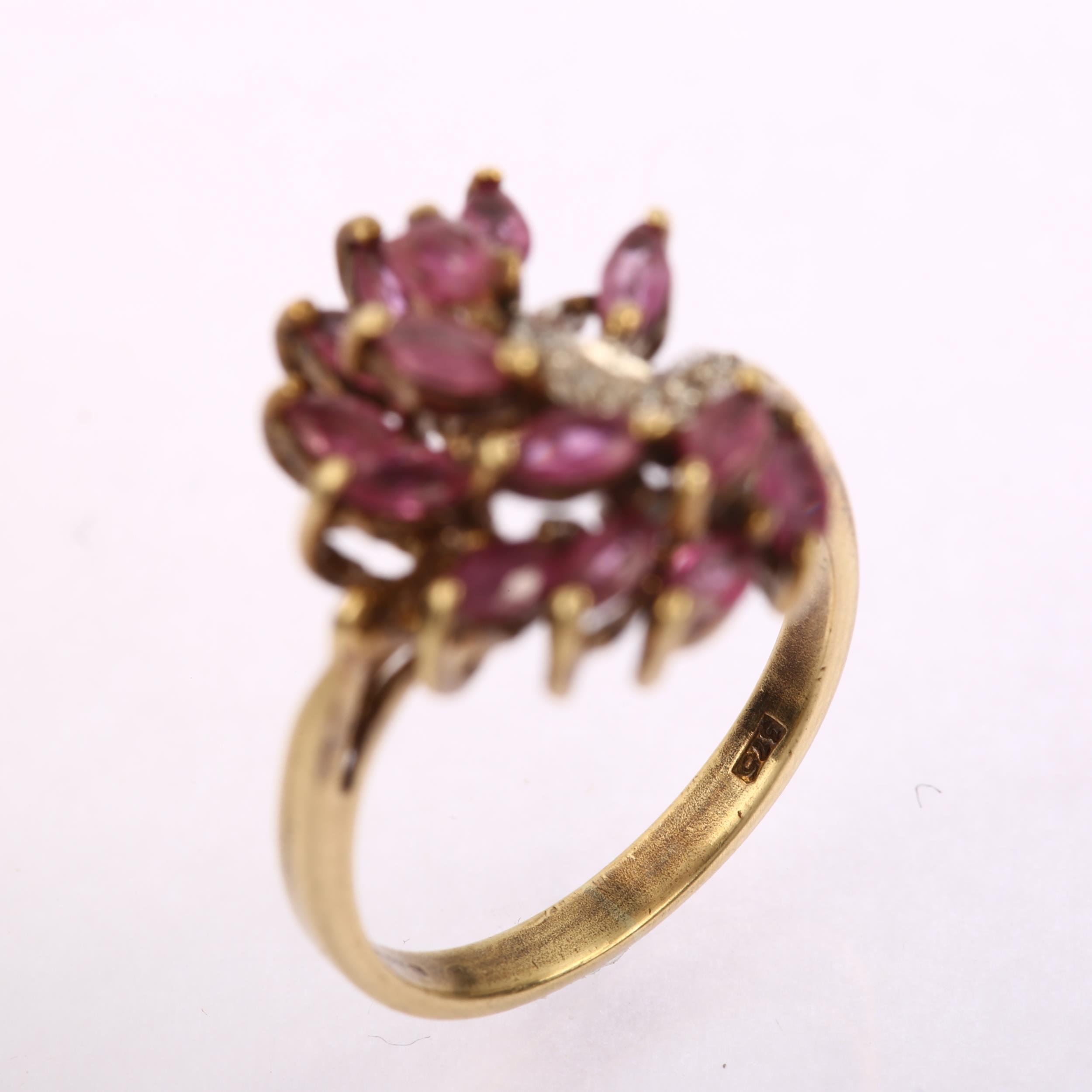 A late 20th century 9ct gold ruby and diamond cluster cocktail ring, set with marquise rubies and - Image 3 of 4