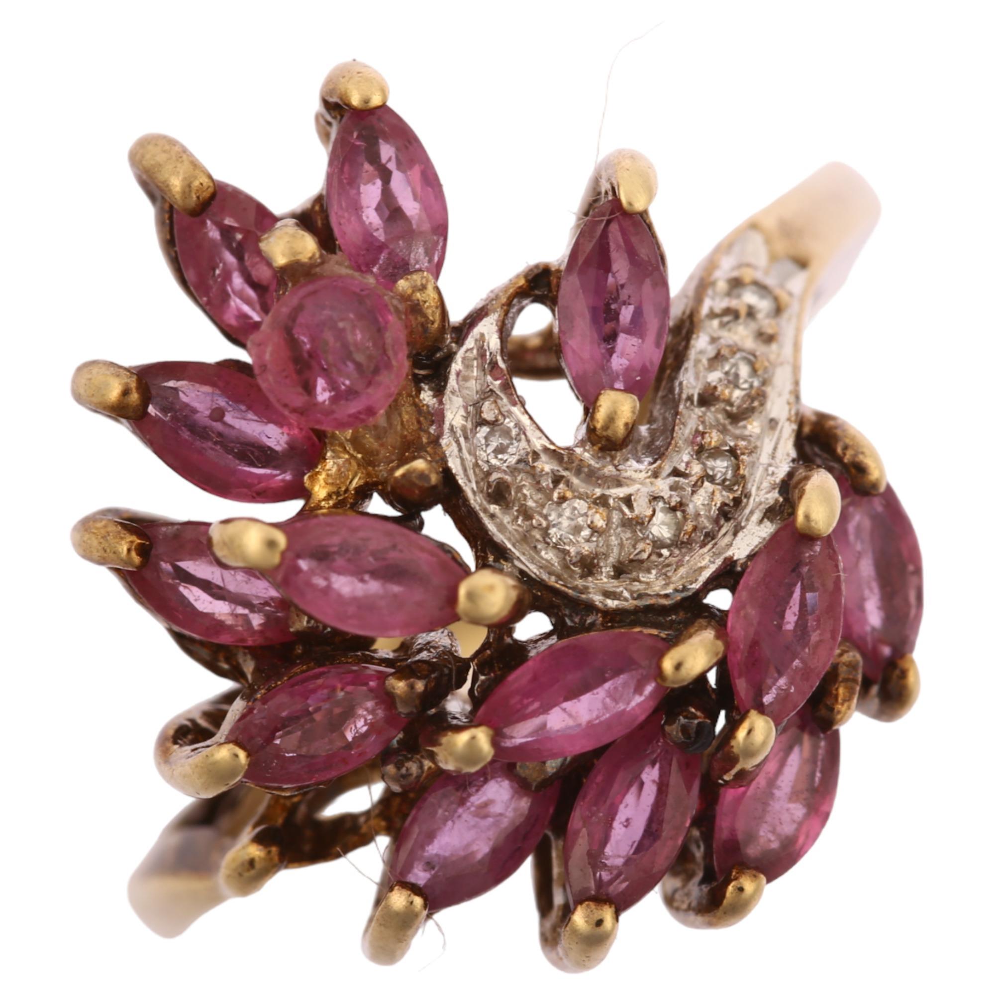 A late 20th century 9ct gold ruby and diamond cluster cocktail ring, set with marquise rubies and