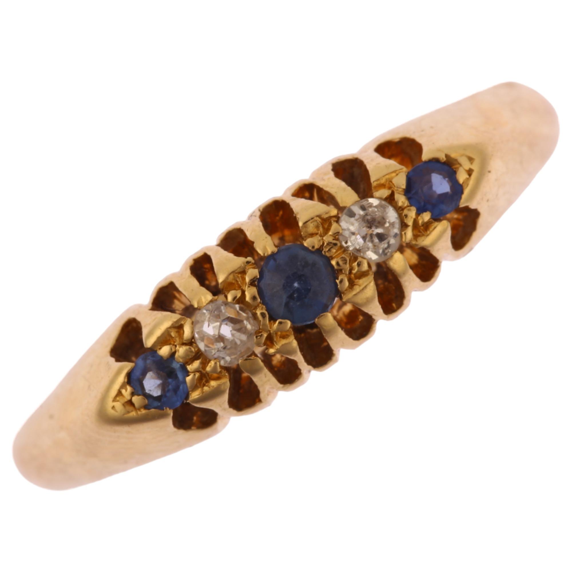 An early 20th century 18ct gold graduated five stone sapphire and diamond half hoop ring,