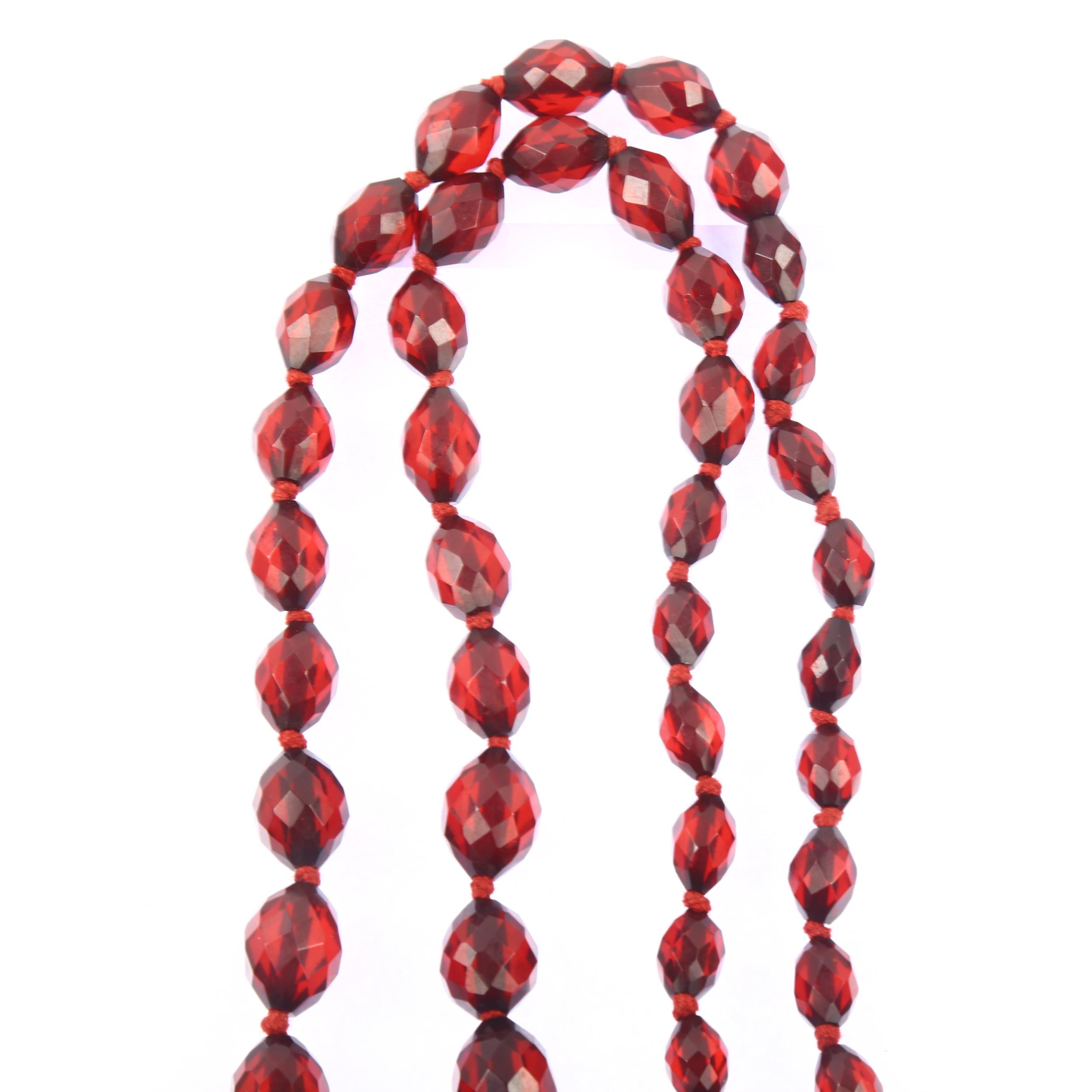 A long graduated single-strand cherry amber bead necklace, beads ranging from 28.1-9.2mm, necklace - Image 3 of 4