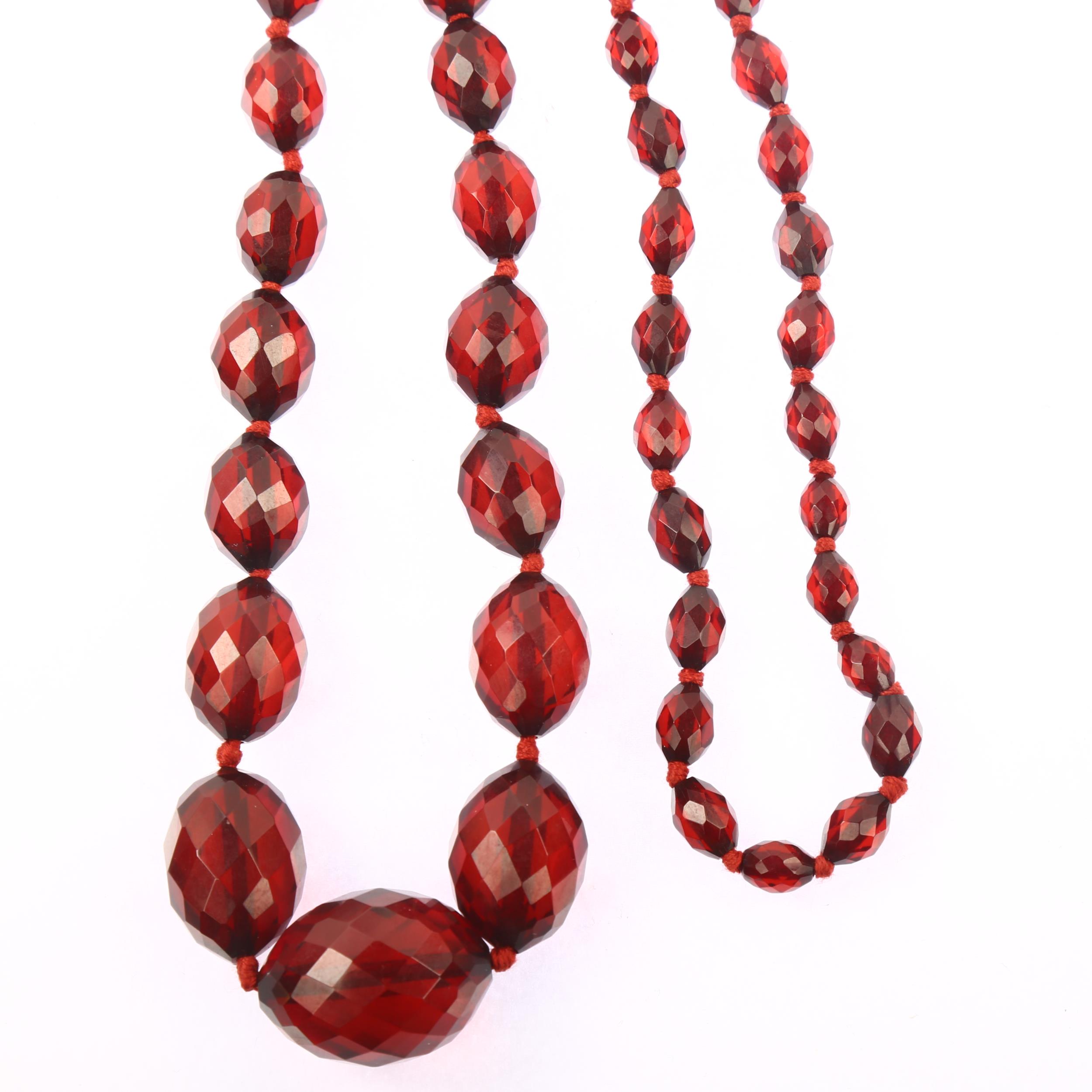 A long graduated single-strand cherry amber bead necklace, beads ranging from 28.1-9.2mm, necklace - Image 2 of 4