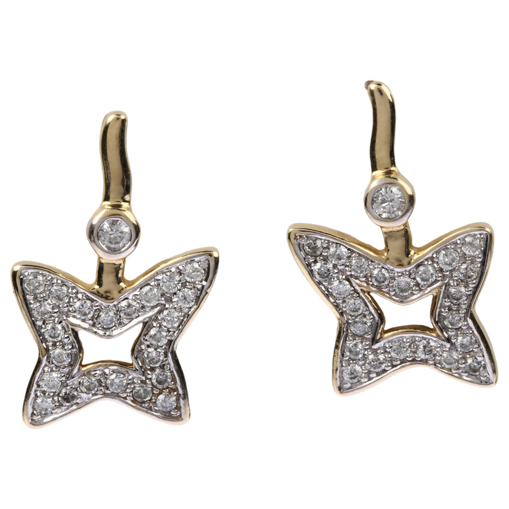 A pair of 9ct gold diamond star earrings, pave set with modern round brilliant-cut diamonds and stud