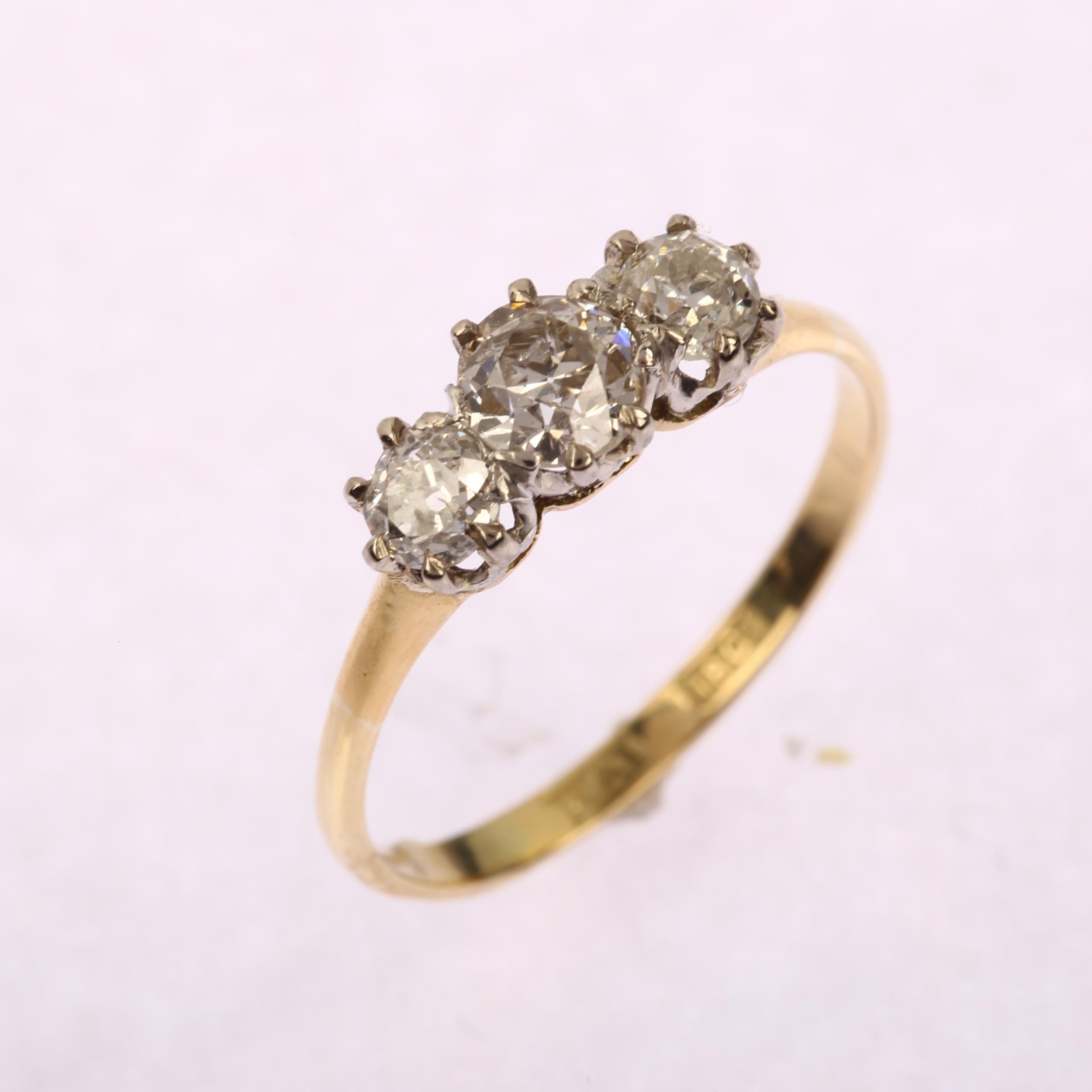 An early 20th century 18ct gold three stone diamond ring, set with old European-cut diamonds, - Image 2 of 4