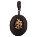 A large Victorian jet mourning locket pendant, circa 1880, with applied gold and split pearl