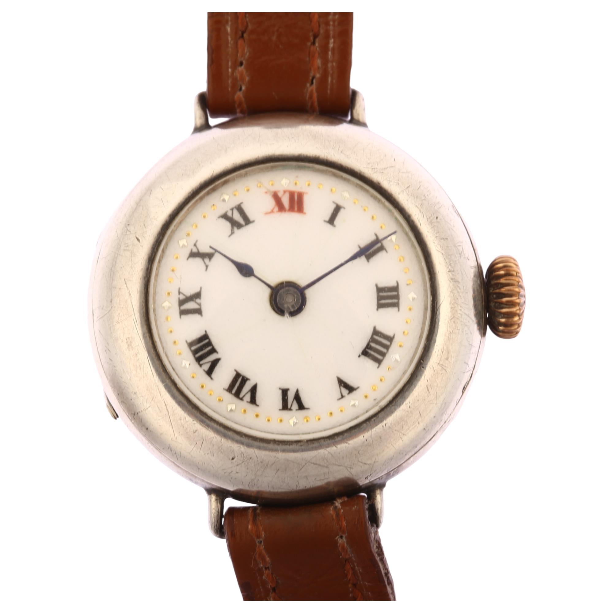 A First World War Period silver Officer's trench style mechanical wristwatch, white enamel dial with