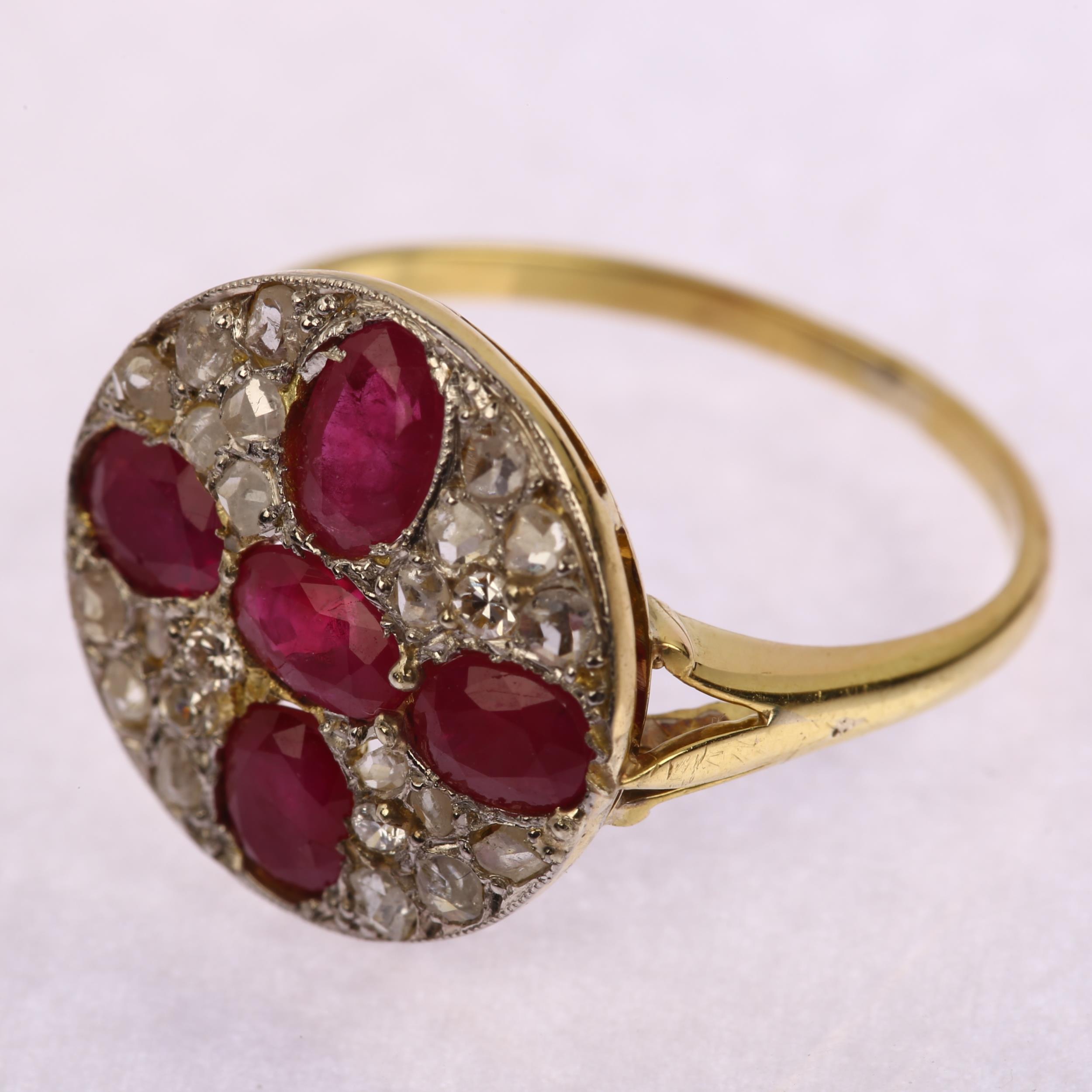 A late 20th century ruby and diamond circular cluster ring, unmarked 18ct gold settings with oval - Image 3 of 4