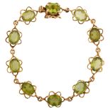 A late 20th century 9ct gold peridot line bracelet, each flowerhead panel set with an oval mixed-cut