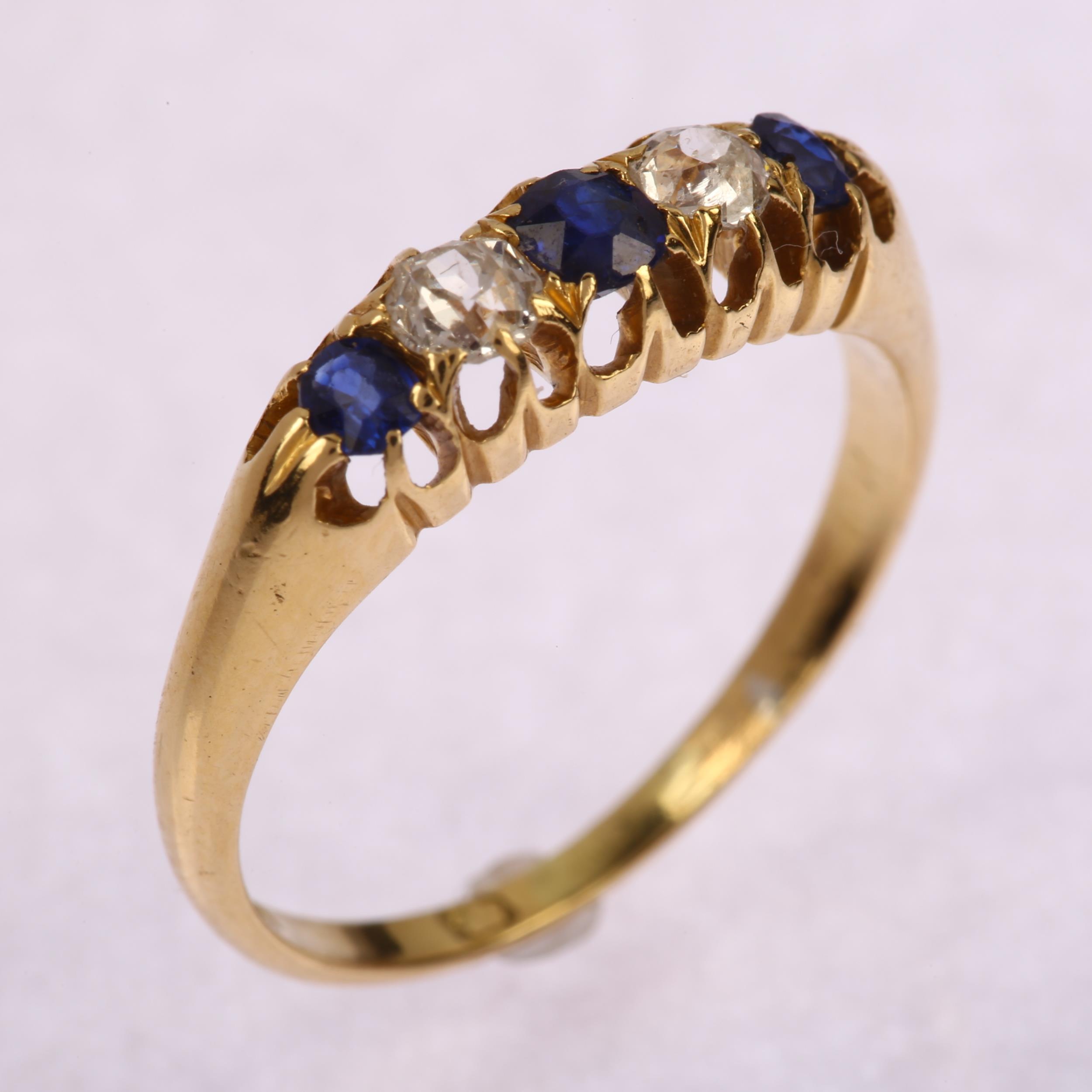An early 20th century 18ct gold graduated five stone sapphire and diamond half hoop ring, set with - Image 2 of 4