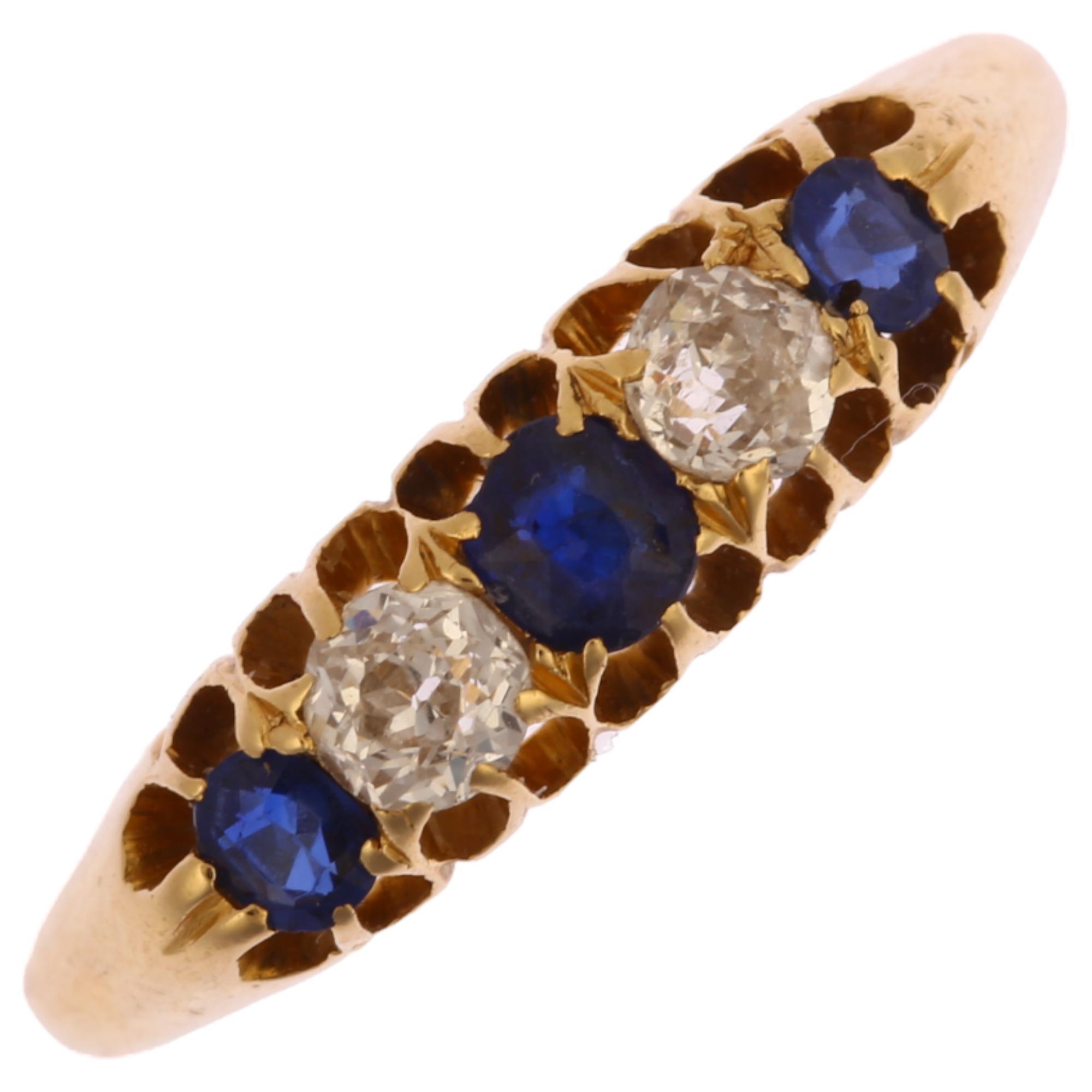An early 20th century 18ct gold graduated five stone sapphire and diamond half hoop ring, set with