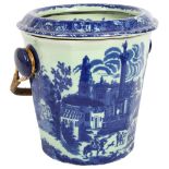 A reproduction blue and white slop bucket with wicker handle, H28cm