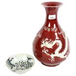 A large Chinese porcelain Sang de Boeuf 'Dragon' pear-shaped vase, Yuhuchunping, with applied dragon