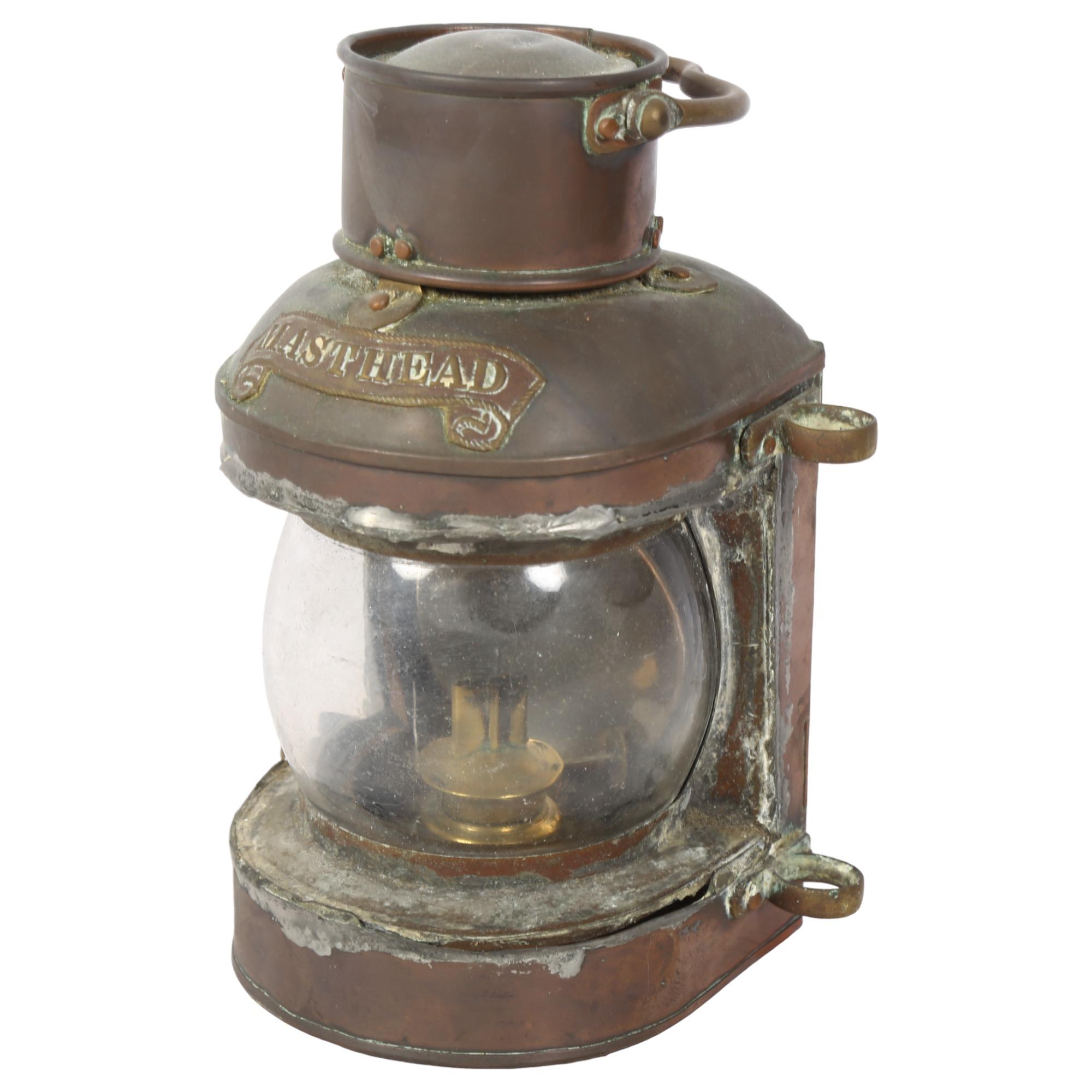 A Victorian copper ship's masthead lantern with swing handle, H22cm Lantern's in well used