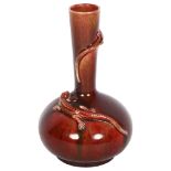 An Oriental sang de boeuf vase, with applied climbing lizards, H19cm