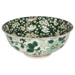 A large Chinese green enamelled and prunus decorated centre bowl, diameter 30cm Bowl has been staple