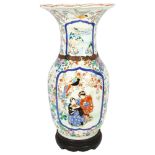 A Chinese enamel decorated vase on turned wood stand, depicting birds and figures