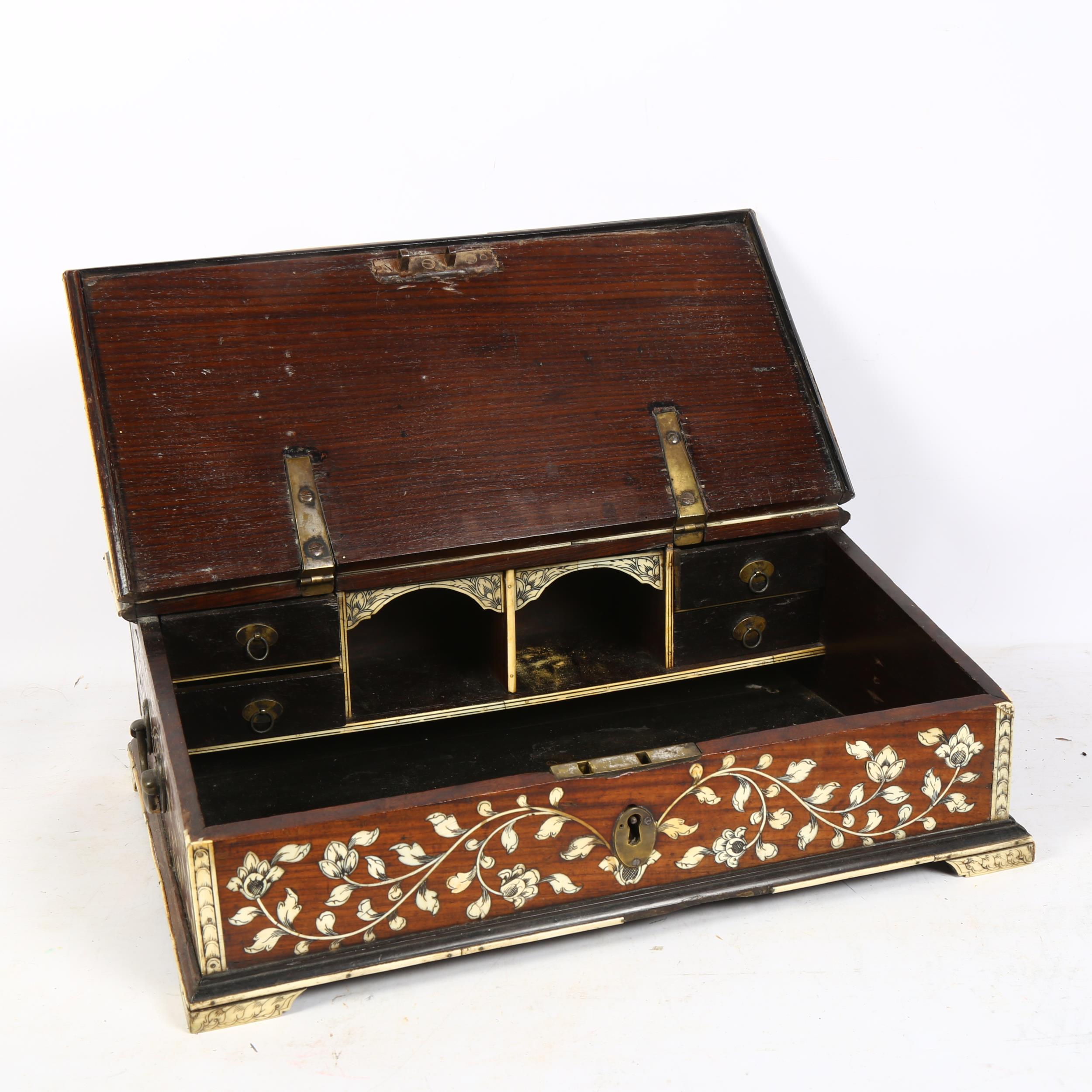 A 19th century Indo-Portuguese writing box, teak and floral ivory inlaid, the rising top revealing - Image 2 of 2