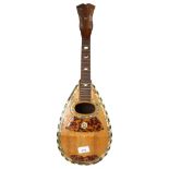 A 19th century rosewood mandolin with ebony and mother of pearl banding and decoration, label to