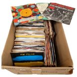 A quantity of 7" vinyl records, mostly in associated sleeves, including such artists as The